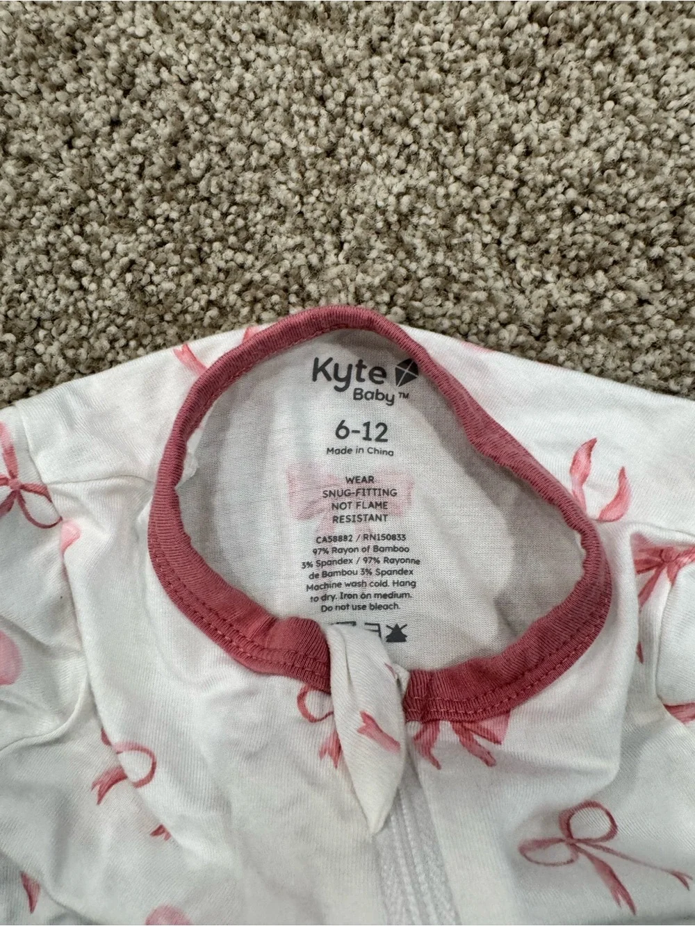 Kyte BABY White Footed One-Piece with Pink Bow Print